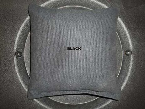 black cornhole bag