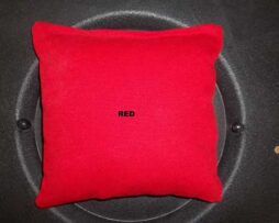 red cornhole bag
