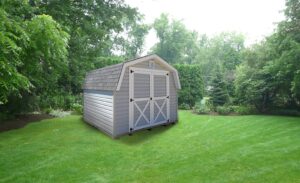 Barn-style-storage-building-with-gray-vinyl-siding