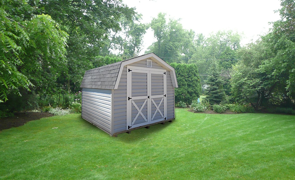 Barn-style-storage-building-with-gray-vinyl-siding