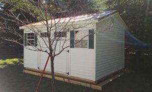 Gable-Storage-Building-White-vinyl-siding-Copper-metal-roof-943x576