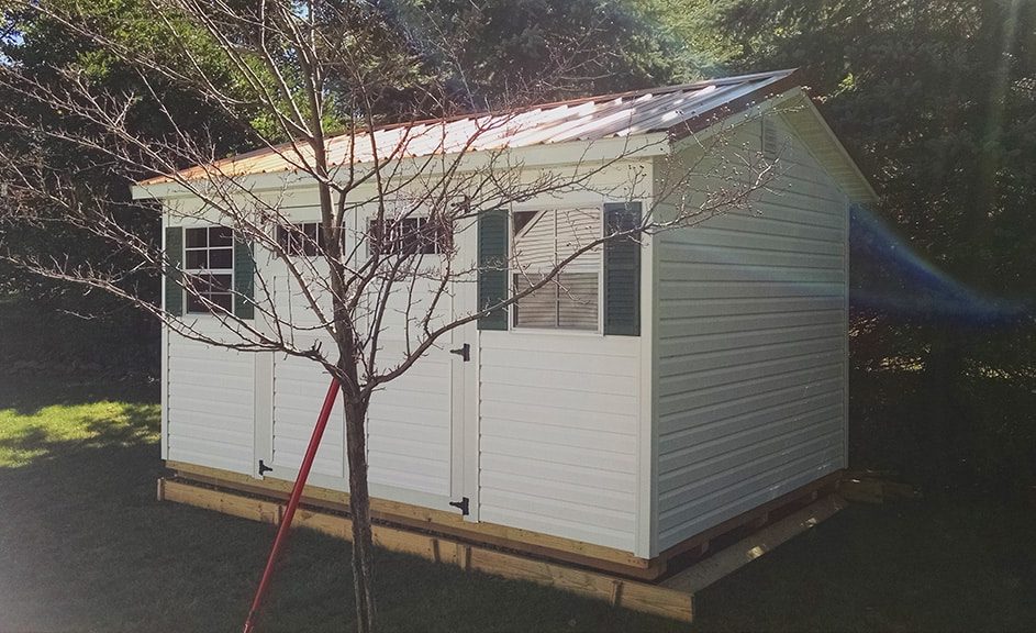 Gable-Storage-Building-White-vinyl-siding-Copper-metal-roof-943x576