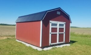 highwall-barn-with-jamestown-red-wood-siding-and-black-metal-roof-943x576