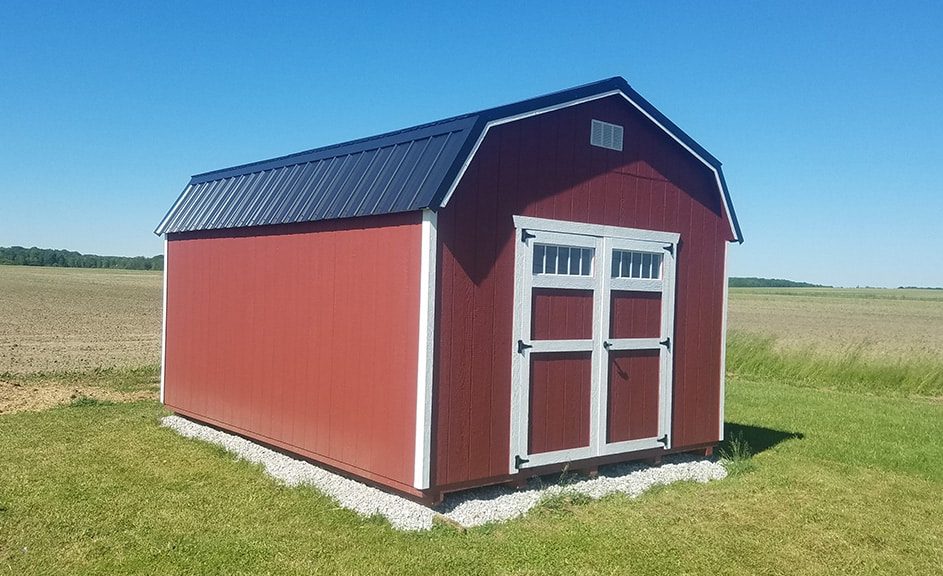 highwall-barn-with-jamestown-red-wood-siding-and-black-metal-roof-943x576