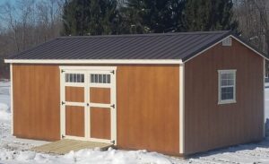 wood-siding-gable-storage-barn-with-butternut-stain-navaho-white-trim-burnished-slate-roof-943x576